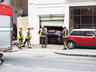 The fire brigade blocks off the street and try to ...